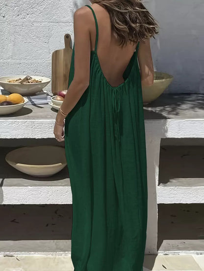 URBANOMAX adjustable strap backless maxi dress, flowing fabric, and elegant design perfect for home or casual wear.