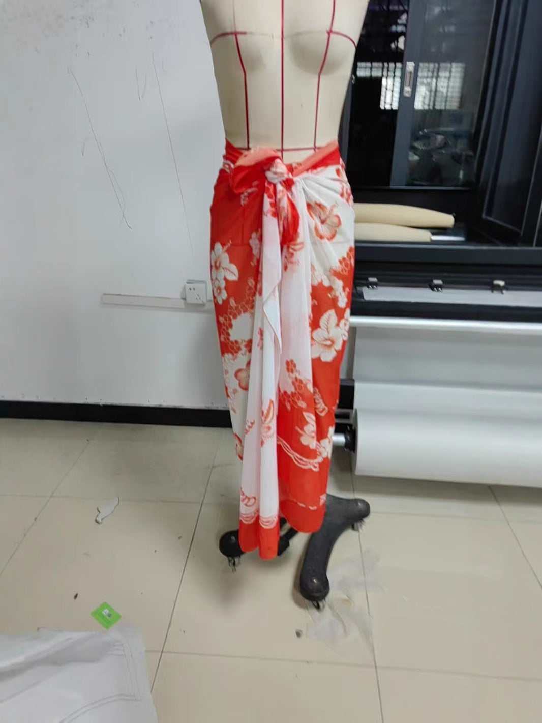 Women's floral print chiffon beach skirt by CHRISTMAS, flowing fabric with vibrant floral patterns, perfect for summer or beachwear.