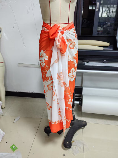 Women’s floral print chiffon beach skirt by CHRISTMAS, lightweight and flowy with vibrant floral patterns, perfect for summer outings.