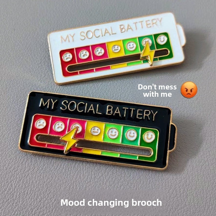Christmas Social Battery Pin™ featuring festive holiday design with a small, colorful Christmas-themed pin in a close-up view.