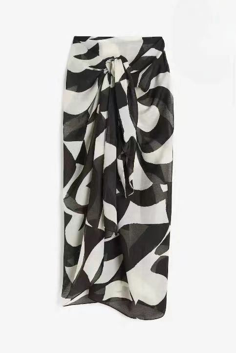 Women's floral print chiffon beach skirt by CHRISTMAS, lightweight and flowy with vibrant floral patterns, perfect for summer wear.