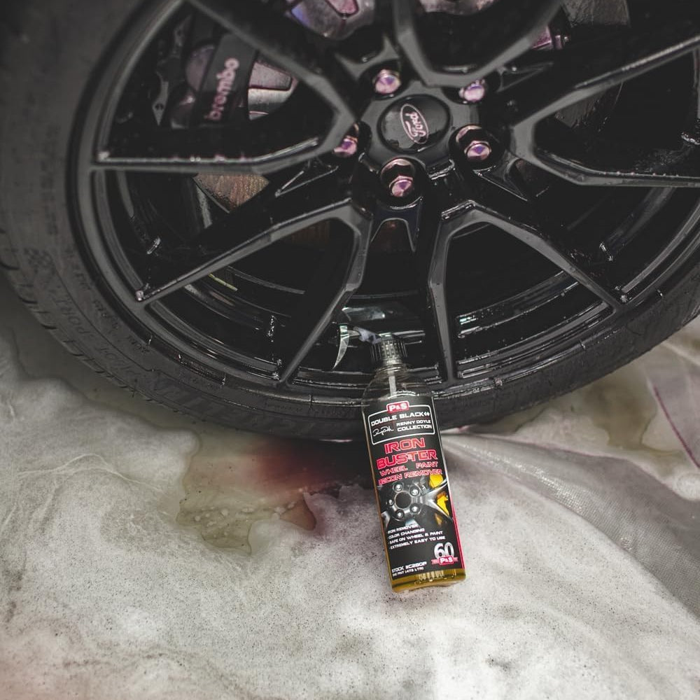 Urbanomax Iron Buster Pro safe wheel and paint iron remover in a 100 ml bottle, used for cleaning and detailing vehicles.