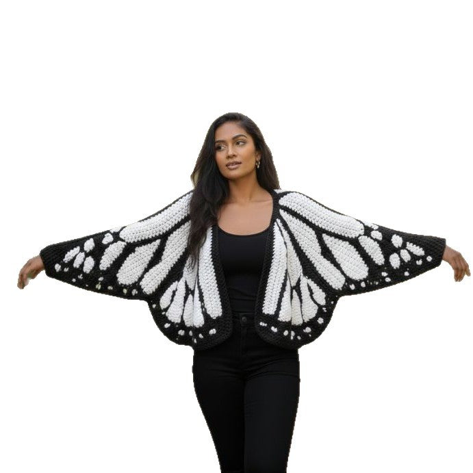 Christmas Monarch Butterfly Knit Cardigan featuring festive patterns and cozy knit fabric, perfect for holiday wear.