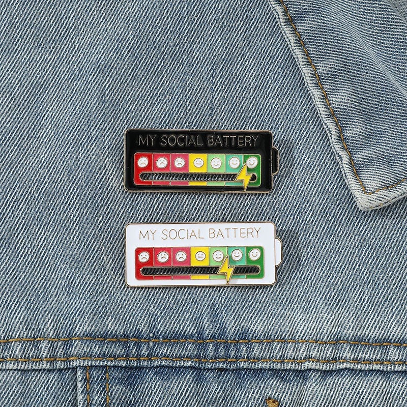 Christmas Social Battery Pin™ featuring festive holiday design and branding, perfect for Christmas accessories and seasonal wear.