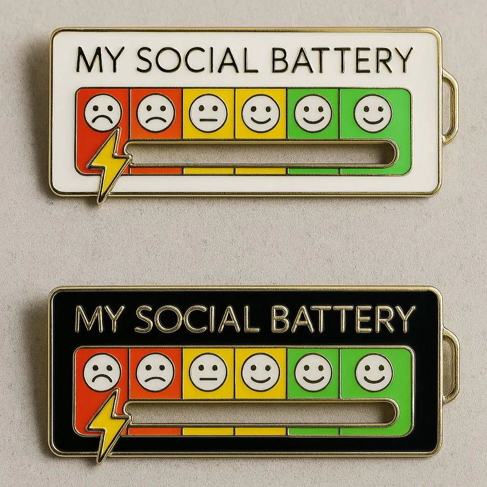 Urbanomax Social Battery Pin™ Christmas enamel pin featuring a festive holiday design on a white background.