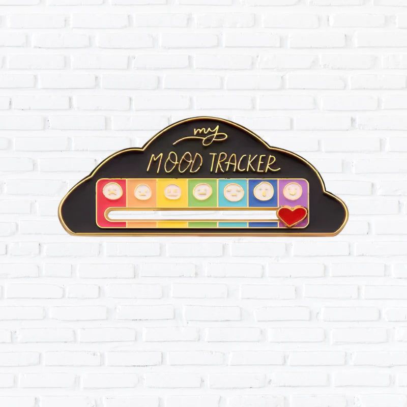 Urbanomax Social Battery Pin™ with Christmas design, featuring a festive holiday-themed metallic pin with colorful details.
