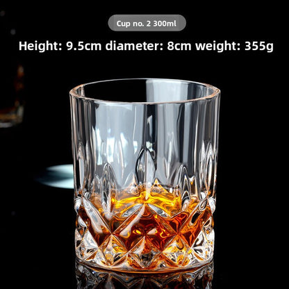 Clear glass whiskey cup with festive Christmas-themed design, perfect for holiday celebrations.