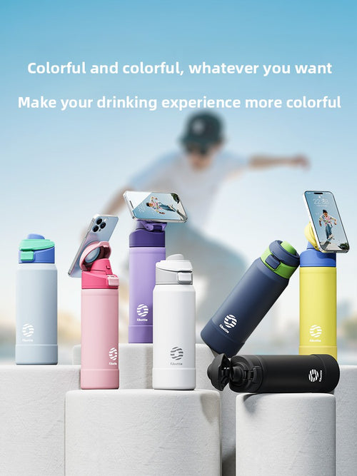 Magnetic insulated sports water bottle with phone holder, featuring a sleek design and vibrant Christmas-themed colors.